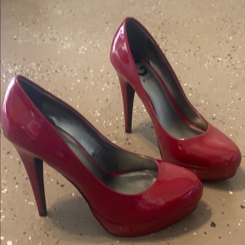 Shiny red Guess heels. Size 7.5